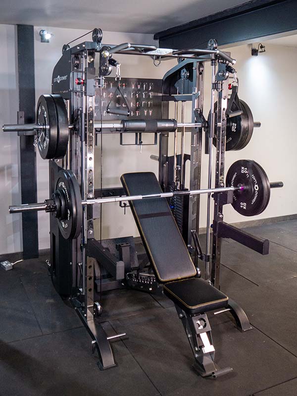 Multi-gym with weight bench, weight plates, smith machine and barbell